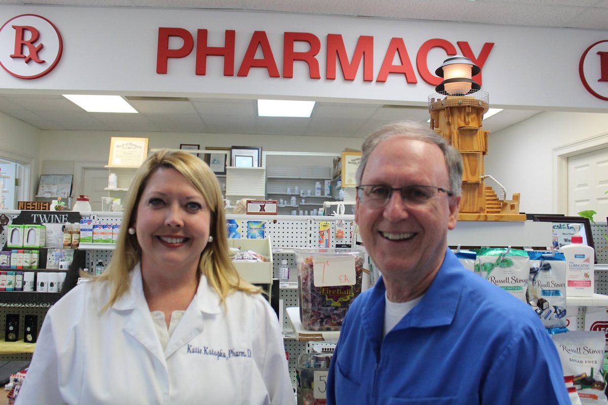 Katie Kotopka, Pharm.D., and Jimmy Parker, R.Ph., behind the pharmacy counter at Waas Drug Store