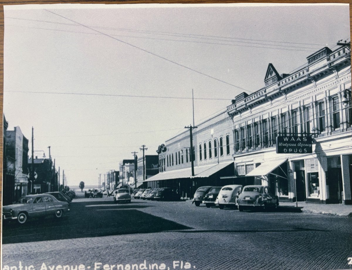 Downtown Fernandina in the late 1940s, with the WAAS Walgreen Agency Drugs sign over the corner storefront