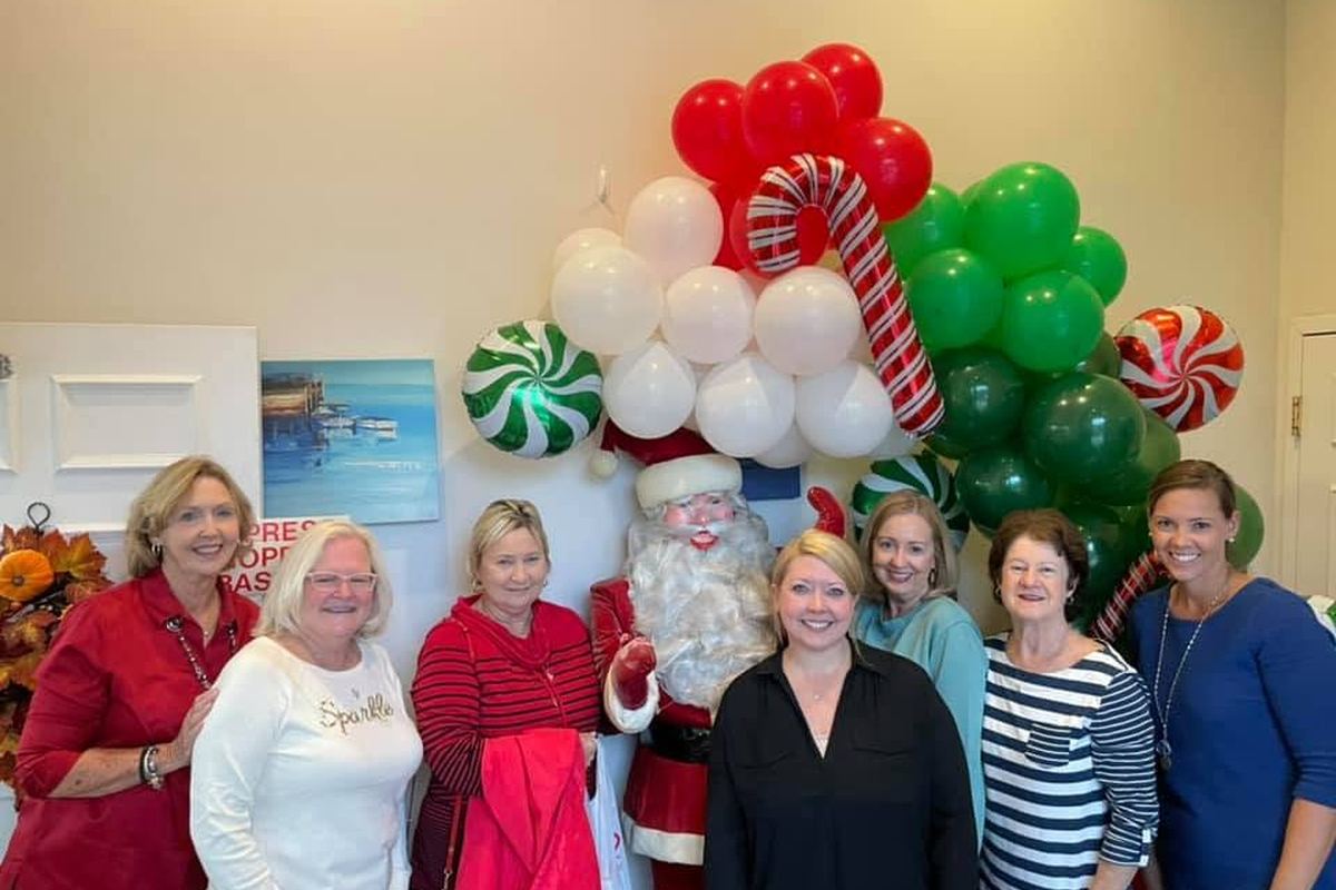 The Waas Drug Store team with Santa at the annual Christmas Open House